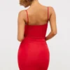 Aniela Slinky Jersey minijurk met rozenmotief en uitsnijdingen in scharlakenrood