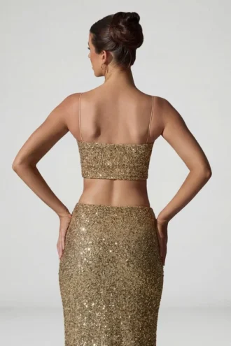Ariana versierde crop top met uitsnijdingen in goud