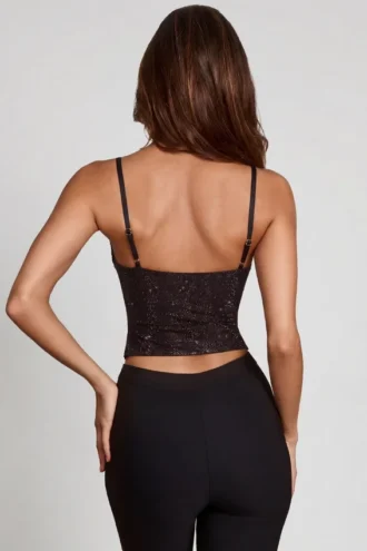 Armelia versierde top met cowl-hals en peekaboo-detail in zwart