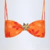 Baracoa bikinitop met halternek en metalen details in oranje orchideeënprint