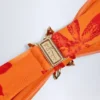 Baracoa bikinitop met halternek en metalen details in oranje orchideeënprint