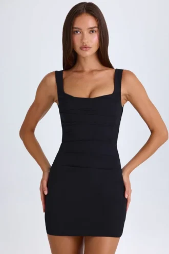 Brittany gedrapeerde, gestructureerde mini-corsetjurk in zwart