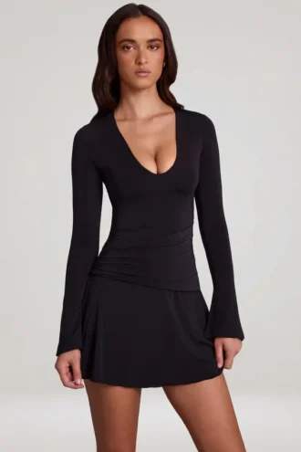 Carielle minijurk van zachte jersey met ronde hals en uitlopende pijpen in zwart
