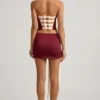 Carola satijnen minirok met strikdetail en lage taille in wijnrood