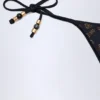 Cebu stringbikini met charm-detail in zwart