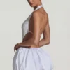 Cece minijurk met versierde uitsnijdingen en bubbelzoom in wit