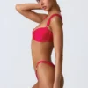 Coquina-bikini-top met versieringen in frambozenroze