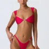 Coquina-bikini-top met versieringen in frambozenroze