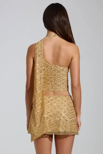 Cosette Top met asymmetrische sjaaldetails en versieringen in goud
