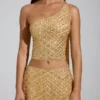 Cosette Top met asymmetrische sjaaldetails en versieringen in goud