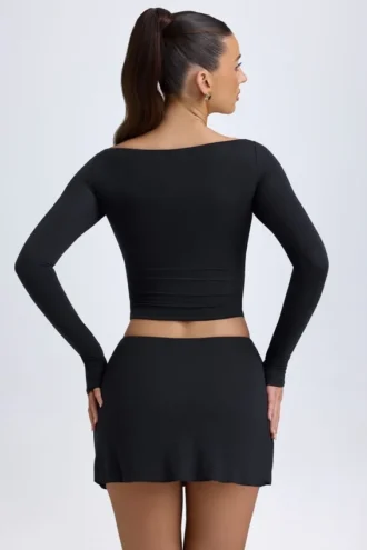 Dalla Modal Minirok met Knopen en Lage Taille in Zwart