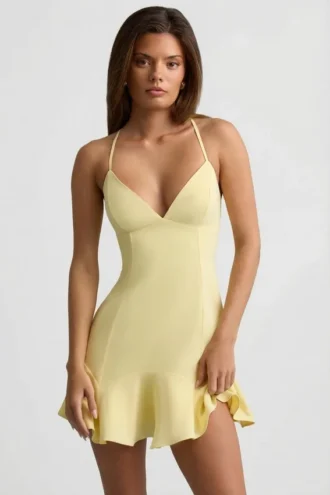 Daria minijurk met lage taille en vetersluiting in geel