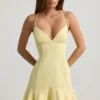 Daria minijurk met lage taille en vetersluiting in geel