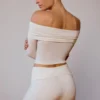 Doorschijnende off-shoulder top met lange mouwen in zacht wit