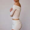 Doorschijnende off-shoulder top met lange mouwen in zacht wit