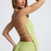 Elania asymmetrische haltertop met open rug in olijfgroen