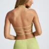 Elania asymmetrische haltertop met open rug in olijfgroen