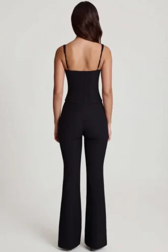 Elanie jumpsuit met ronde hals, korset en uitlopende pijpen in zwart