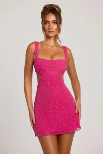 Emilion versierde mini-jurk met uitsnijdingen in fuchsia
