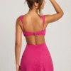 Emilion versierde mini-jurk met uitsnijdingen in fuchsia