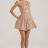Felicity minijurk met halternek, versiering en bubbelzoom in amandelkleur