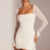 Ferrara minijurk met lange mouwen, versierde col en witte kleur