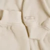 Geborsteld jersey cropped bolero met capuchon in ecru