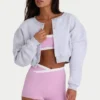 Geborsteld jersey cropped vest met knopen in grijs gemêleerd