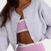 Geborsteld jersey cropped vest met knopen in grijs gemêleerd
