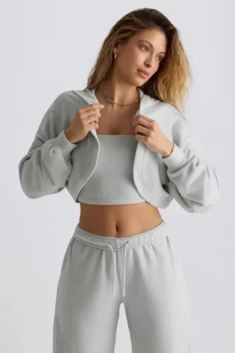 Geborstelde jersey cropped bolero met capuchon in mistgrijs