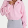 Geribbeld gebreid cropped sweatshirt met rits in lichtroze