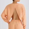 Getextureerd katoenen jersey cropped sweatshirt met open rug in perzik