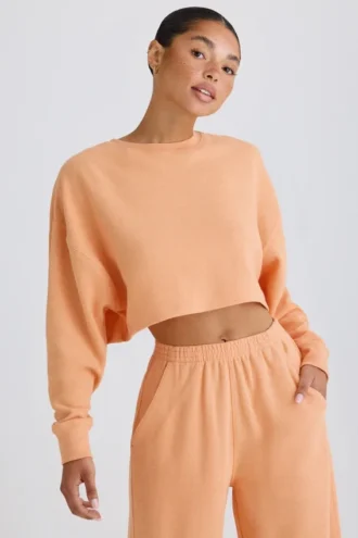 Getextureerd katoenen jersey cropped sweatshirt met open rug in perzik