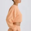 Getextureerd katoenen jersey cropped sweatshirt met open rug in perzik