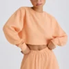 Getextureerd katoenen jersey cropped sweatshirt met open rug in perzik