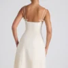 Isadora midi-jurk met strikdetail en plooien in ivoorkleur