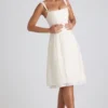 Isadora midi-jurk met strikdetail en plooien in ivoorkleur