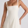 Isadora midi-jurk met strikdetail en plooien in ivoorkleur