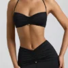 Jerika Slinky Jersey Halternek-bralette met metalen details in zwart