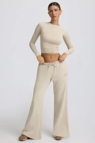 Joggingbroek met lage taille en wijde pijpen in ivoorkleur