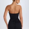 Kalinda gerimpelde bandeau-minijurk in zwart