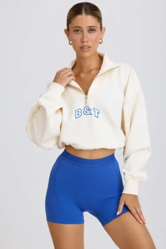 Kort sweatshirt met kwartritssluiting in wit
