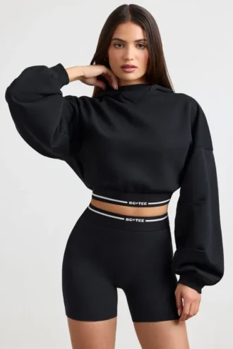 Korte hoodie van stretchkatoenfleece in zwart