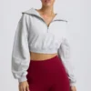 Korte sweater met kwartritssluiting in grijs gemêleerd