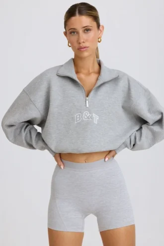 Korte sweater met kwartritssluiting in grijs gemêleerd
