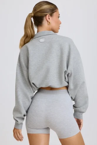 Korte sweater met kwartritssluiting in grijs gemêleerd