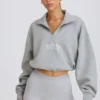 Korte sweater met kwartritssluiting in grijs gemêleerd