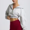 Korte sweater met kwartritssluiting in grijs gemêleerd
