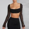 La Desirade versierde crop top met col in zwart