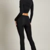 Mairead asymmetrische gedrapeerde flared broek met middelhoge taille in zwart